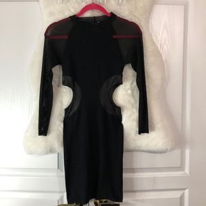 A sexy black dress open from the sides from bebe